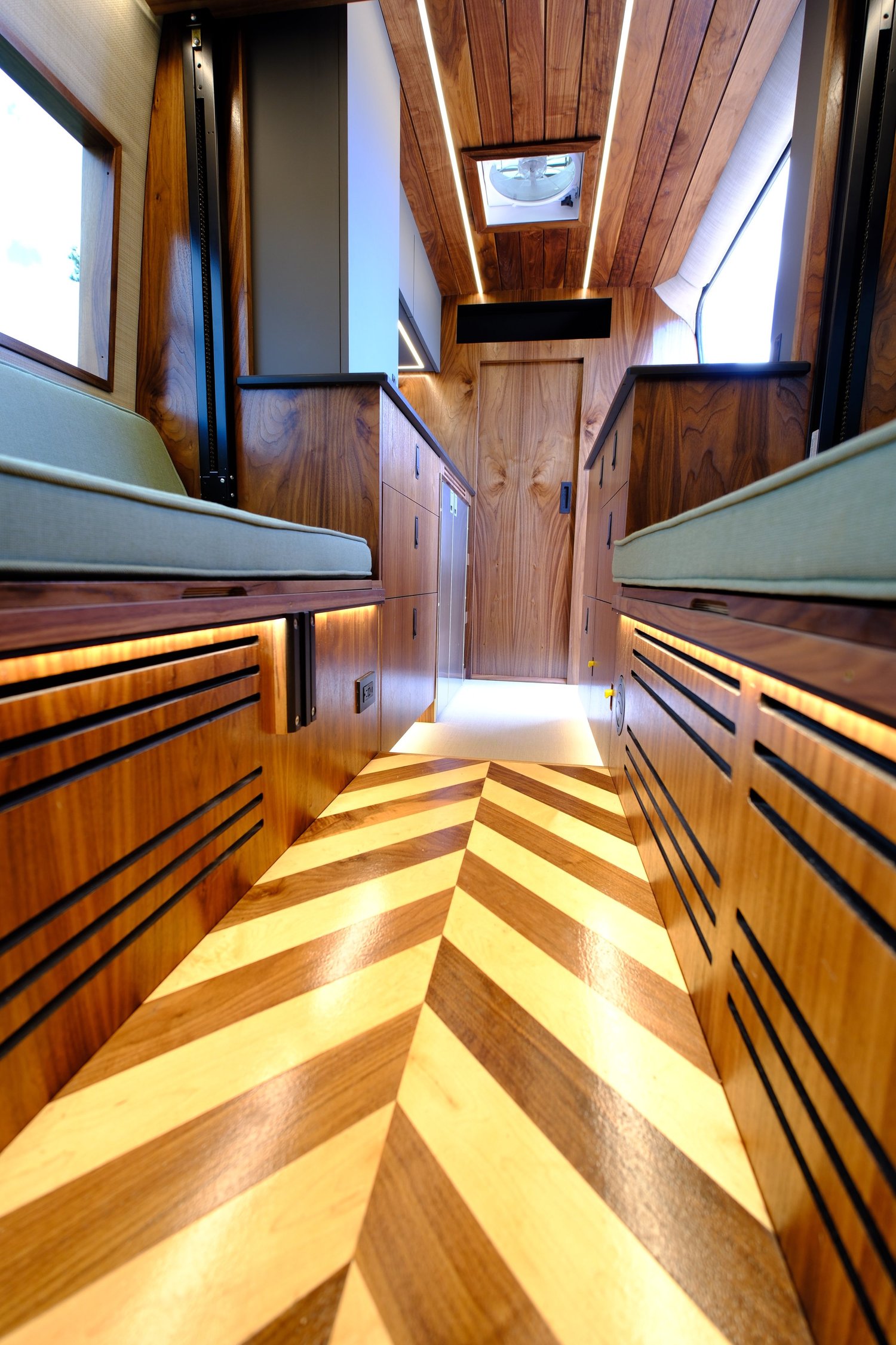 Bourbon dinette with opposing benches and patterned wood flooring