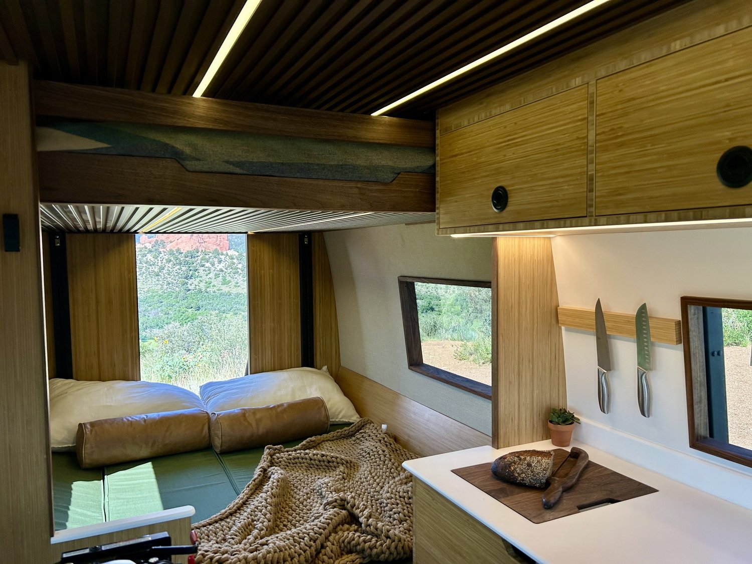 Forest rear sleeping and seating area beneath the elevator bed