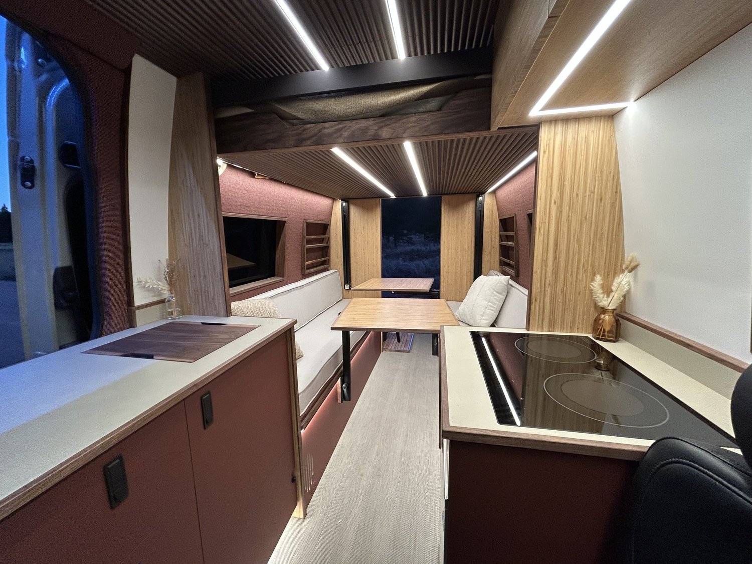 Sienna interior with warm rose cabinetry and a rear dining area