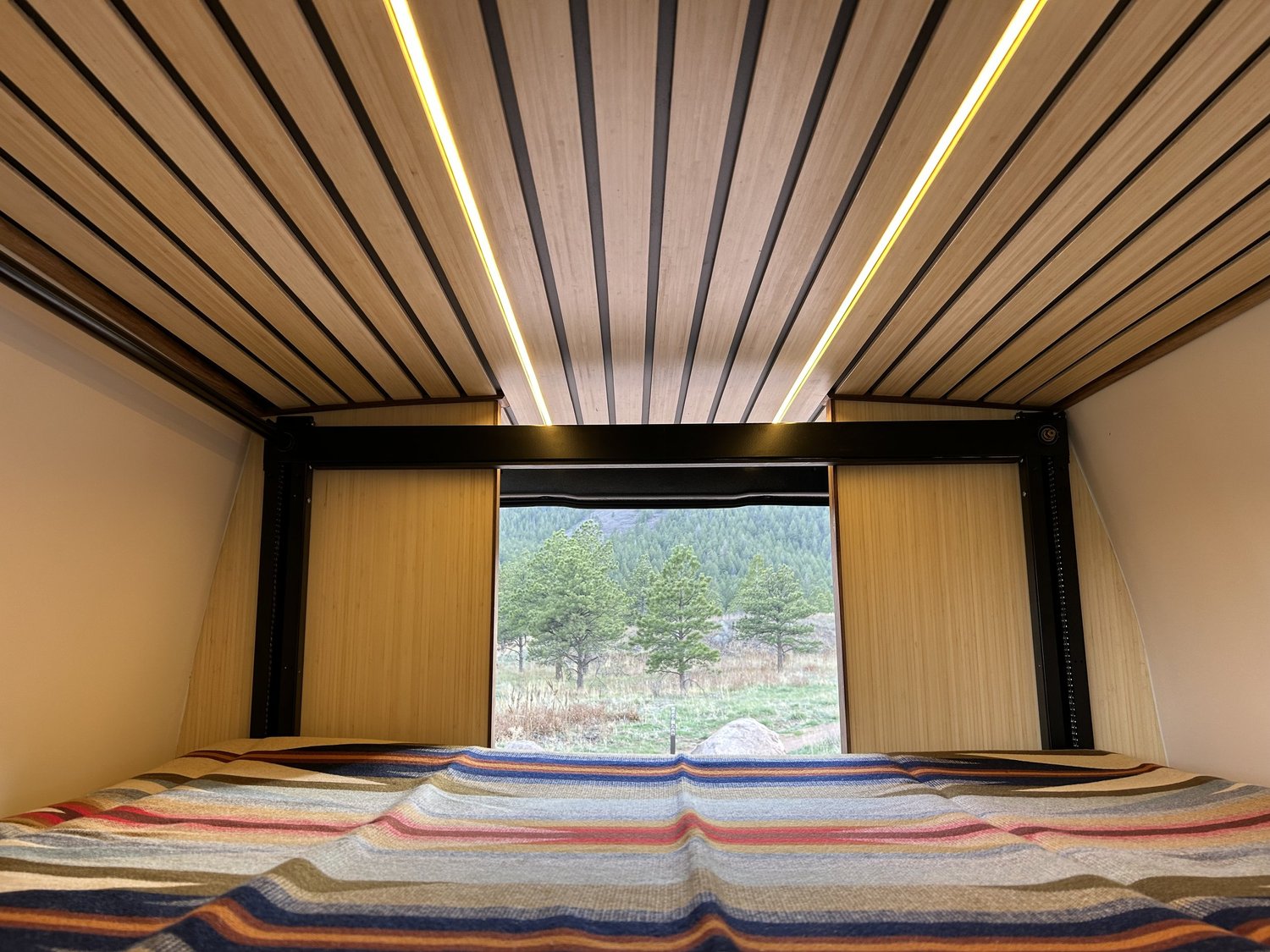 Slate bed beneath a wood slat ceiling