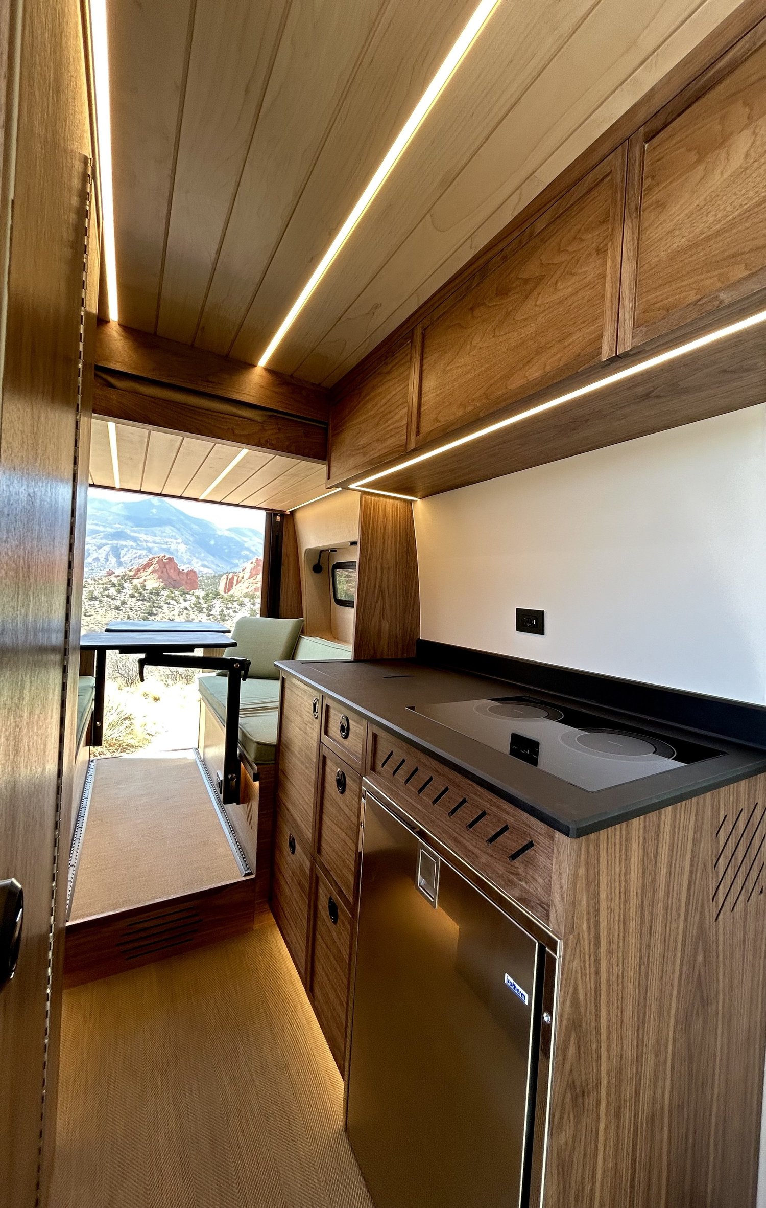 Timber interior with wood cabinetry and a full galley