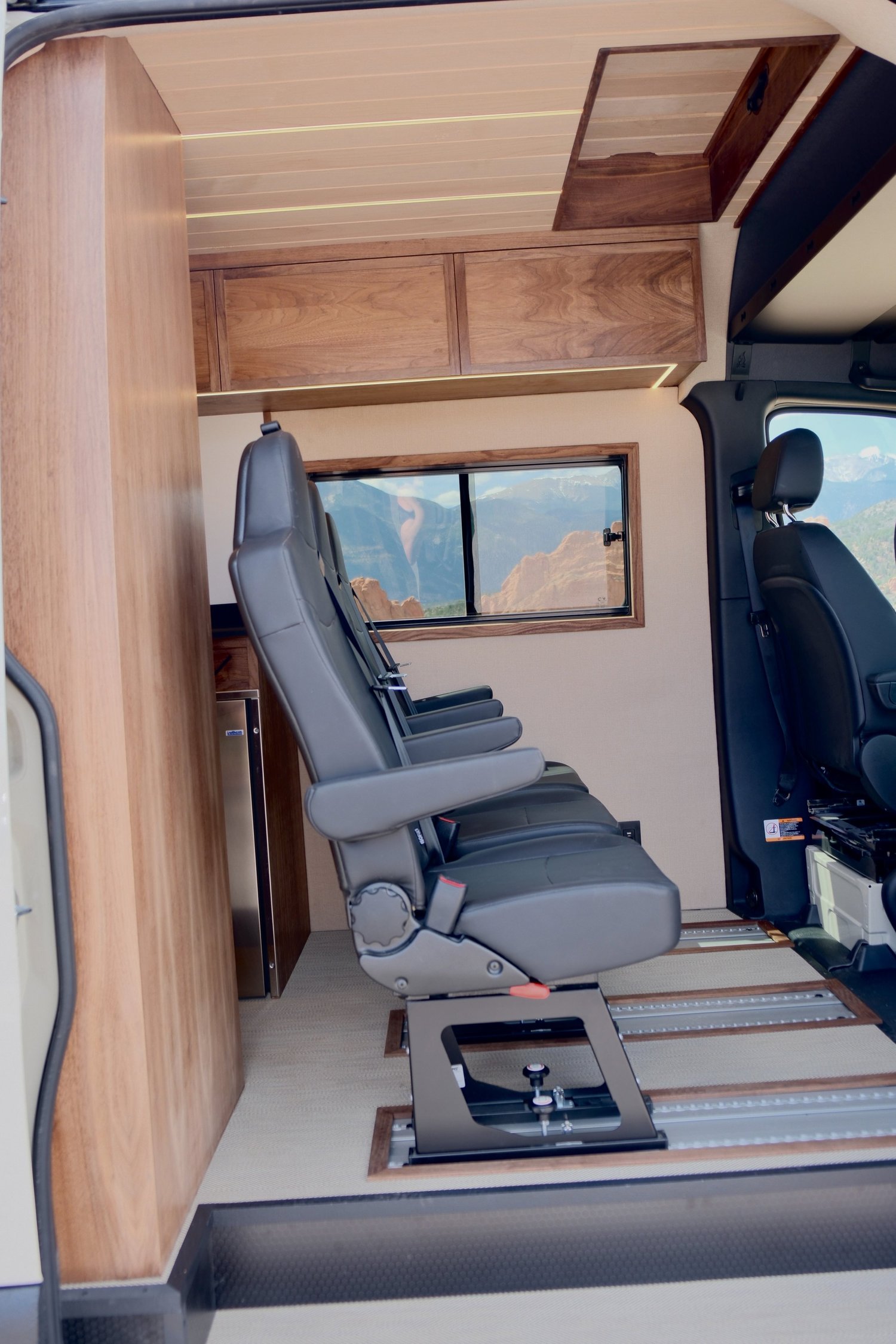 Timber passenger seating beside the sliding door