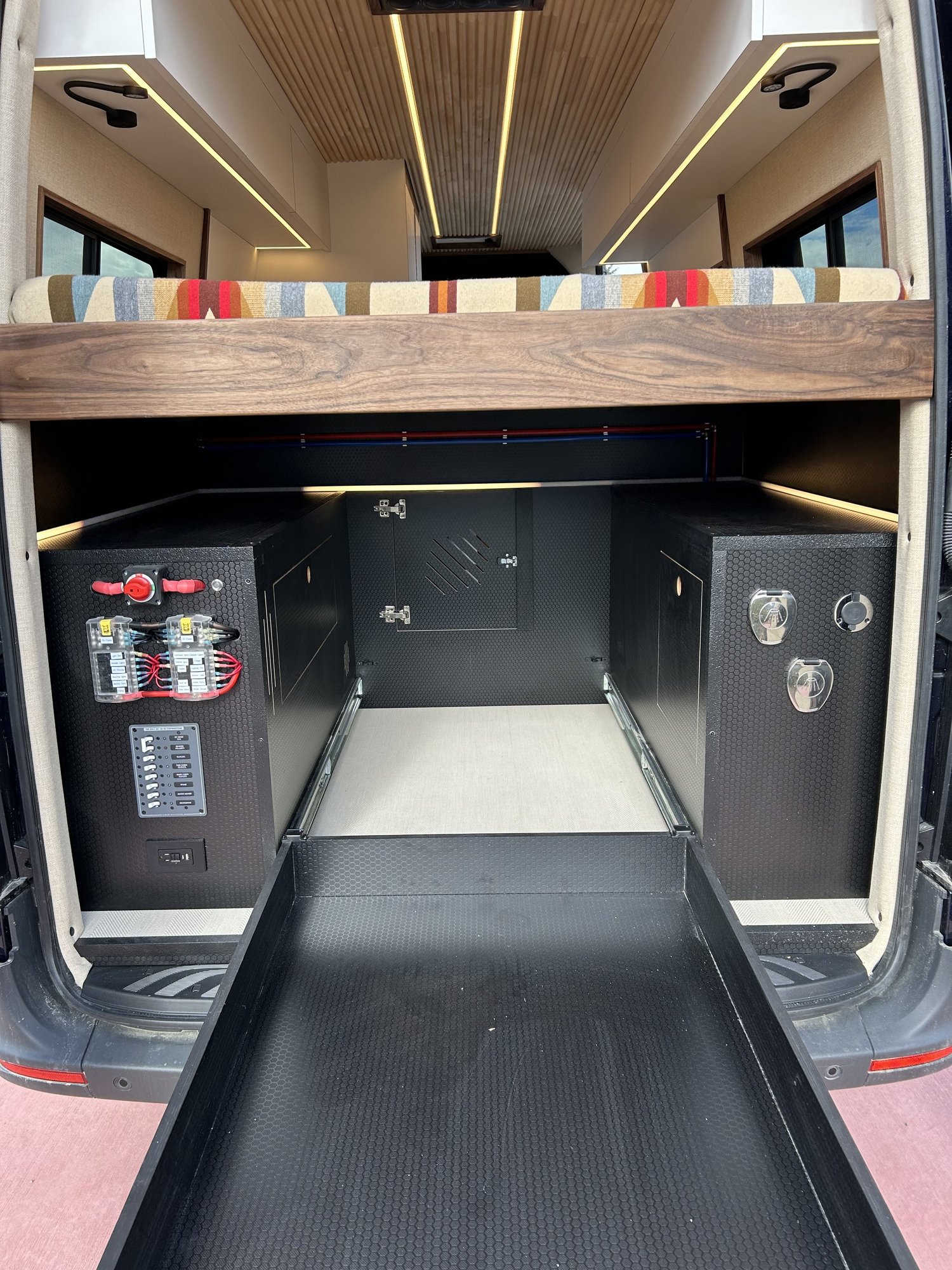 Verde rear garage with a pull-out storage tray beneath the bed