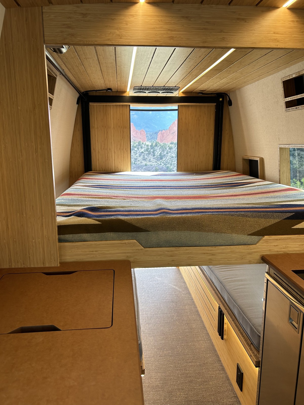 The Den lowered elevator bed with a view through the rear opening.