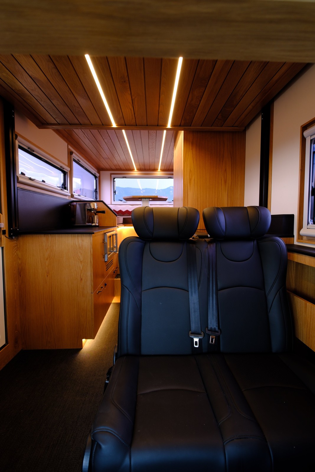 The Nest passenger bench viewed toward the rear galley and dining area.